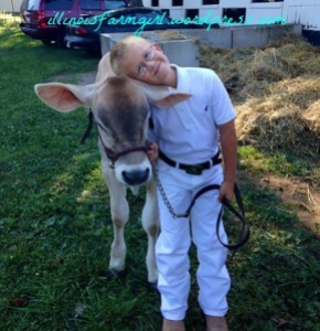 At the fair, my farm boy gives Gabi some love before walking in the ring. 