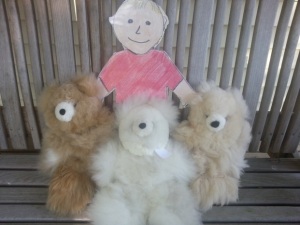 Figure 3. Aggie with teddy bears made from alpaca fiber.